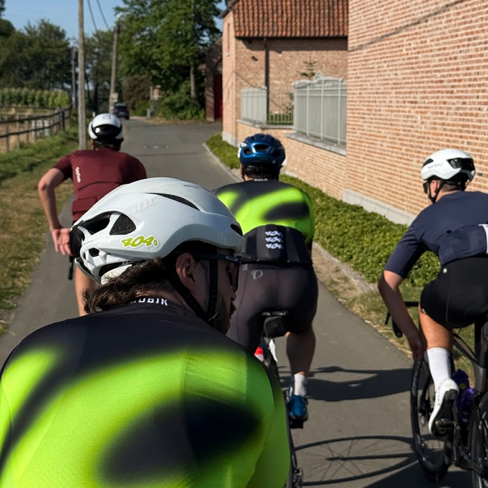 404° riders cycling together on a country lane