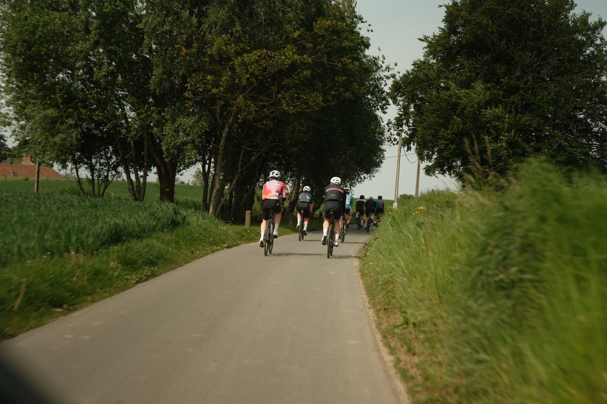 404° riders cycling together through the countryside